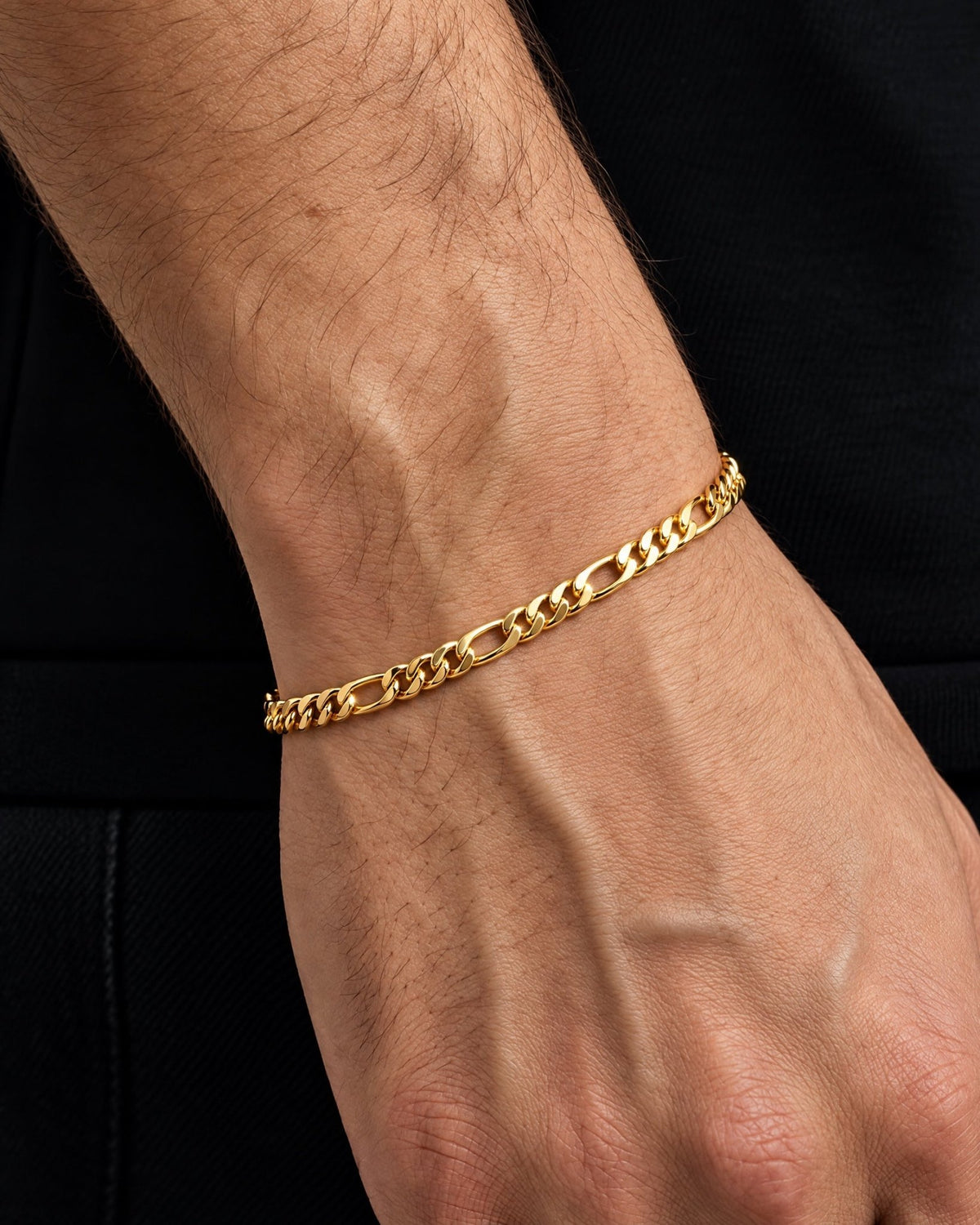 3mm gold Clean Figaro bracelet worn on the wrist